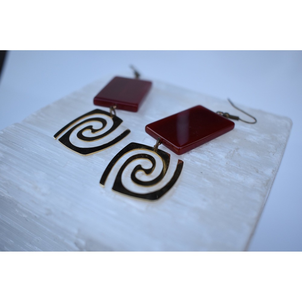 Drama and Swirl gold and Carnelian disco earrings.